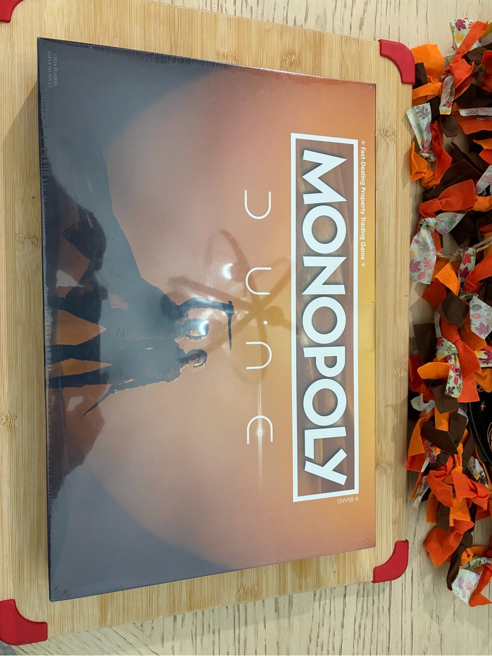 Hasbro Monopoly Dune Edition - Orange and Brown Box